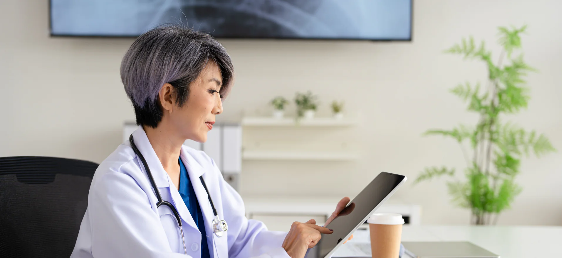 A physician placing an order at a clinic desk